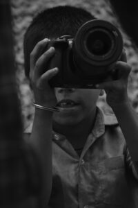 Shri Vatsa U Rai (This photo was captured by me during a street photo-walk, when my friend handed his camera to a child in a street who was seen very happy holding a camera in his hand. His smile made our day and we realized that small act will spread happiness in someone\'s life.)