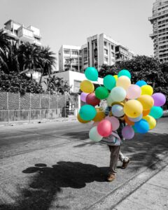 Swaraj Desai (A balloon seller sells his breath till death to spread happiness. While he can’t taste any of it. #shades_of_cliker)